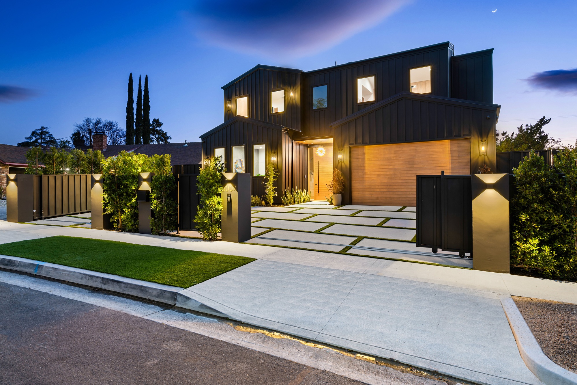 Modern luxury house exterior at dusk.